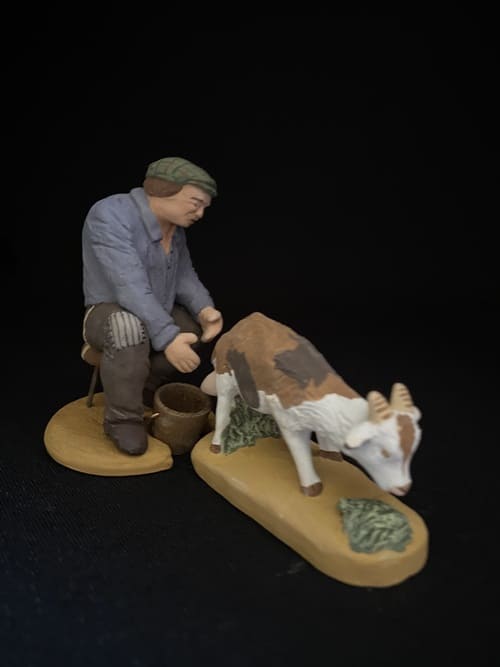 Homme qui trait   58 €